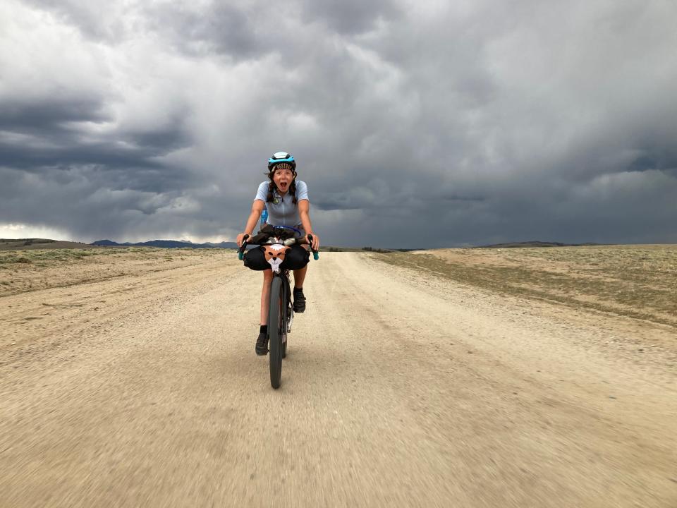 Scarlet Zeigler outrides a storm in the middle of the Great Basin, Wyoming during back-to-back century (100 miles) days on her 2,900-mile ride on the Continental Divide Trail.