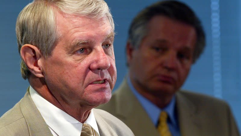 Salt Lake City District Attorney David Yocom is pictured in this 2004 file photo as he announces the charges against Mark Hacking during a press conference as prosecuting attorney Robert Stott looks on. Yocom, whose legal career spanned more than four decades, has died.