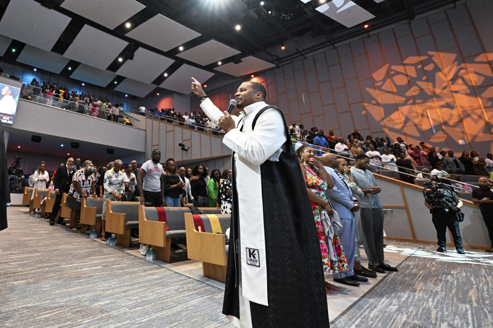 Reverend Matthew L. Watley delivers the benediction during Sunday service at Kingdom Fellowship AME Church, Sunday, June 2, 2024, in Calverton, Md. The suburban Maryland congregation, led by Rev. Watley, has landed at the top of a list of the fastest-growing churches in America. (AP Photo/Terrance Williams)