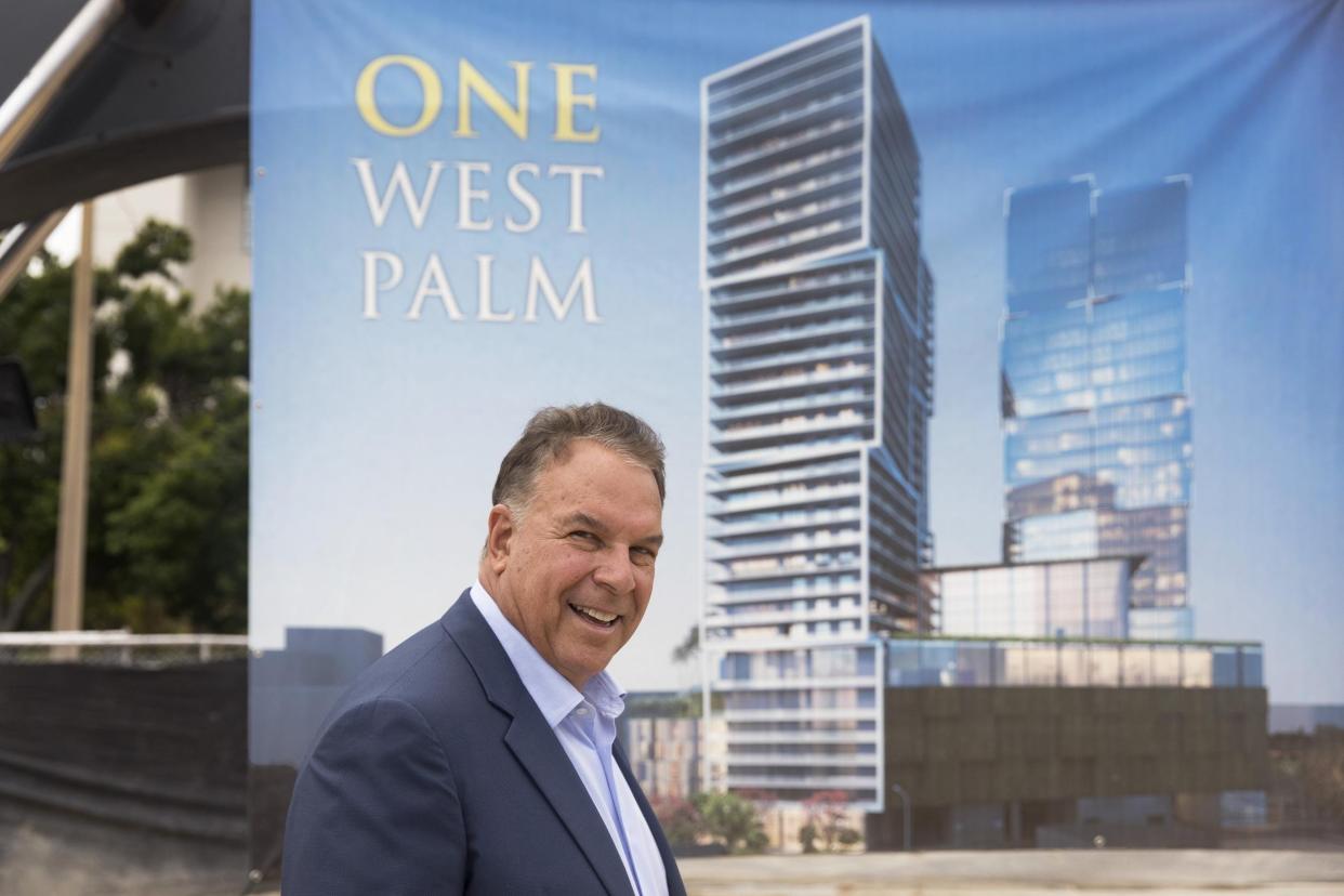 Billionaire developer Jeff Greene next to an artist rendering of One West Palm, a two-tower office/hotel/apartment/retail project at 550 Quadrille Blvd.