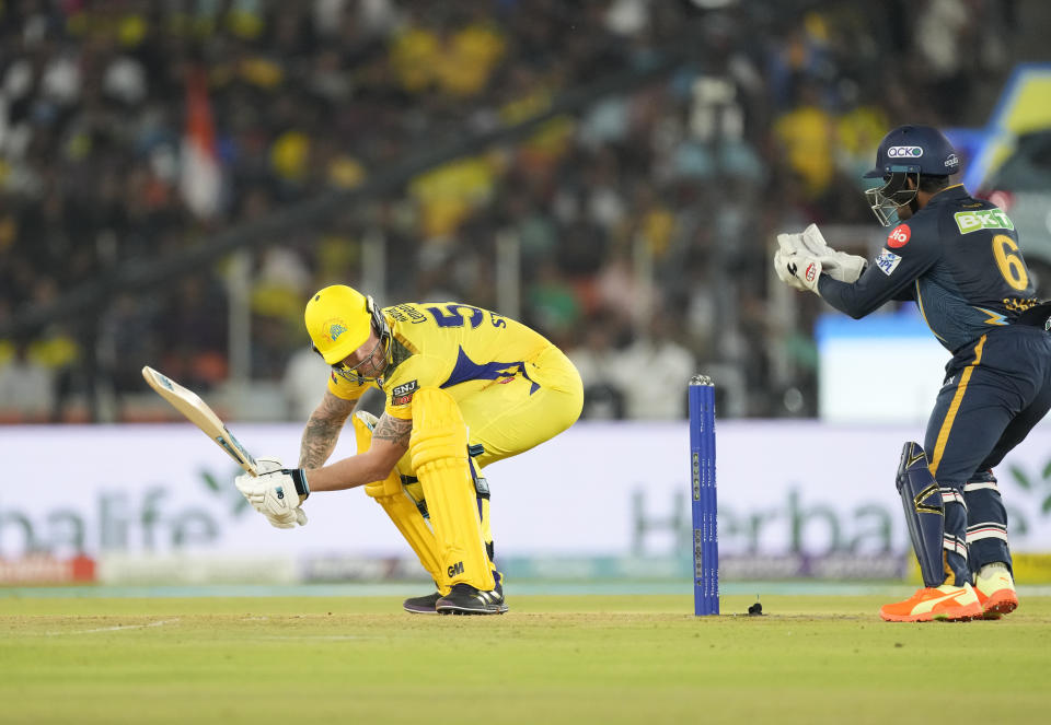 Gujarat Titan's Wriddhiman Saha takes the catch to dismiss Chennai Super Kings' Ben Stokes during their Indian Premier League (IPL) match in Ahmedabad, India, Friday, March 31, 2023. (AP Photo/Ajit Solanki)