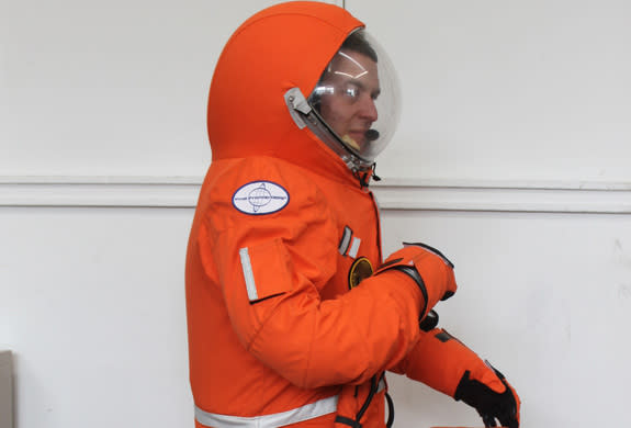 Final Frontier Design's Ted Southern kneels in the third version of his firm's private spacesuit. The spacesuit maker is based in Brooklyn, New York.