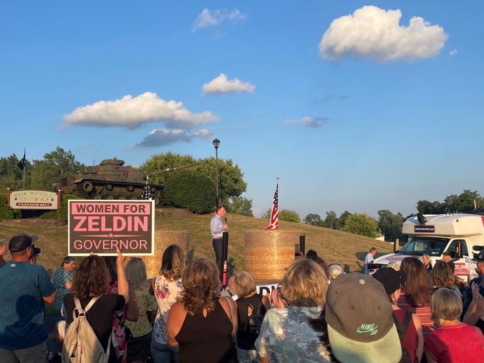 Congressman Lee Zeldin stands on stage after an alleged attack on him during his stump speech, in Fairport, New York, United States, July 21, 2022 (via REUTERS)