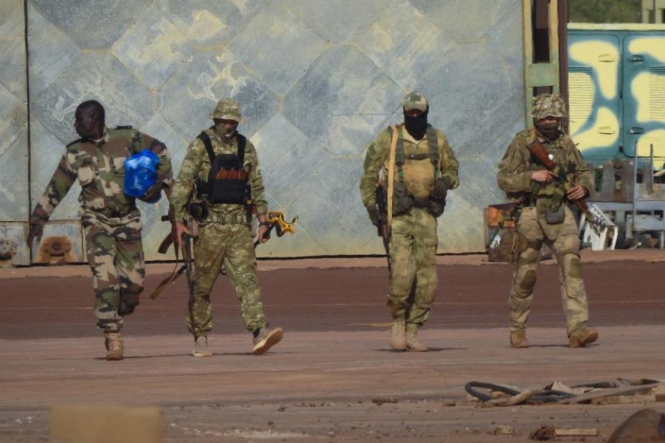 This undated photograph handed out by French military shows three Russian mercenaries, right, in northern Mali.