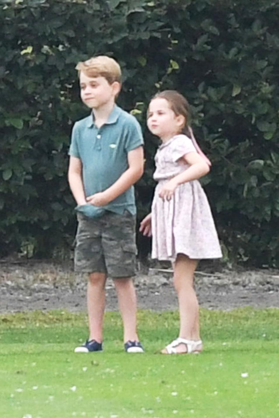 George, who turns 6 on July 22, sported a green polo shirt and shorts for the day outdoors. Charlotte, 4, stayed true to her girly style in a pink dress and white sandals with her hair tied back into a ponytail, complete with a bow.