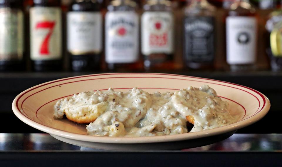 Folks can pair sausage biscuits and gravy with a cocktail at Ryes and Shine breakfast bar, Tuesday, Nov. 28, 2023, in Cuyahoga Falls, Ohio.