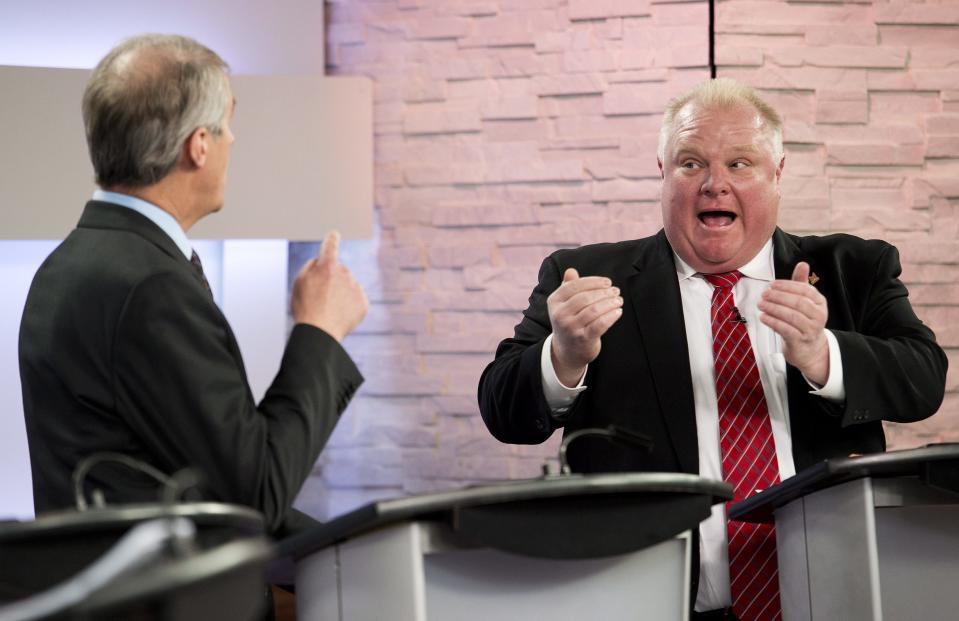 David Soknacki, left, challenges Rob Ford as they take part in the first debate for the Toronto mayoral race in Toronto on Wednesday, March 26, 2014. (AP Photo/The Canadian Press, Nathan Denette)