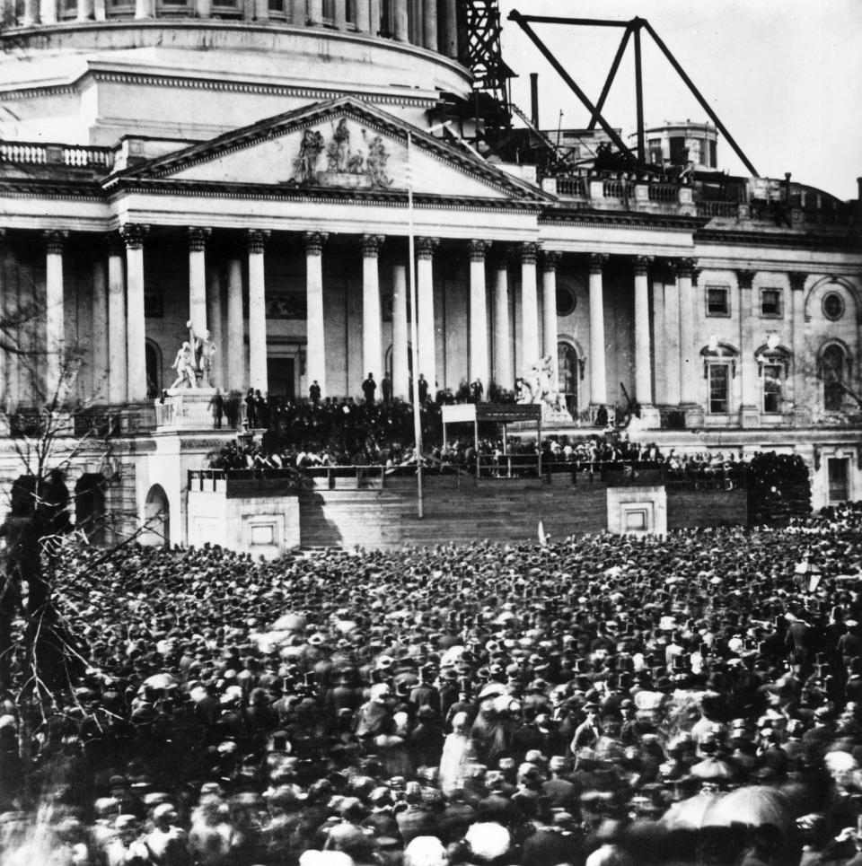Crowds watch the inauguration of Abraham Lincoln on March 4, 1861.