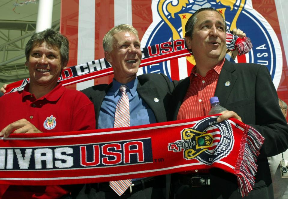 Thomas Rongen, center, the first coach of Club Deportivo Chivas USA, assistant coach Javier "Zuly" Ledesma, left, and investor-operator Jorge Vergara, pose for photographs after a news conference Thursday, Sept. 23, 2004, in Carson, Calif. The newest Major League Soccer expansion club also unveiled the team's colors and official name.