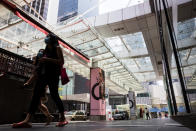 People walking along the Bintang Walk shopping stretch in Kuala Lumpur on 18 March 2020, the first day of the Movement Control Order. (PHOTO: Fadza Ishak for Yahoo Malaysia)
