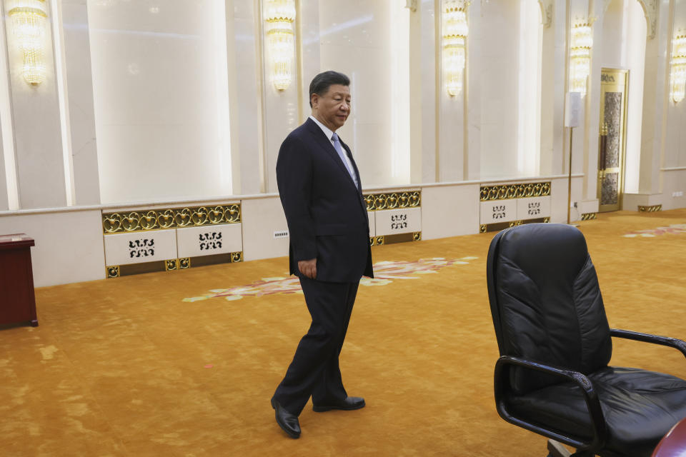 Chinese President Xi Jinping stands as he waits to meet with U.S. Secretary of State Antony Blinken in the Great Hall of the People in Beijing, China, Monday, June 19, 2023. (Leah Millis/Pool Photo via AP)