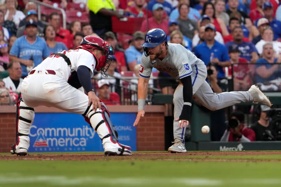 Kansas City Royals’ Kyle Isbel, right, scores past St. Louis Cardinals catcher <a class="link " href="https://sports.yahoo.com/mlb/players/10166/" data-i13n="sec:content-canvas;subsec:anchor_text;elm:context_link" data-ylk="slk:Willson Contreras;sec:content-canvas;subsec:anchor_text;elm:context_link;itc:0">Willson Contreras</a> during the fifth inning in the second game of a baseball doubleheader Wednesday, July 10, 2024, in St. Louis. (AP Photo/Jeff Roberson)