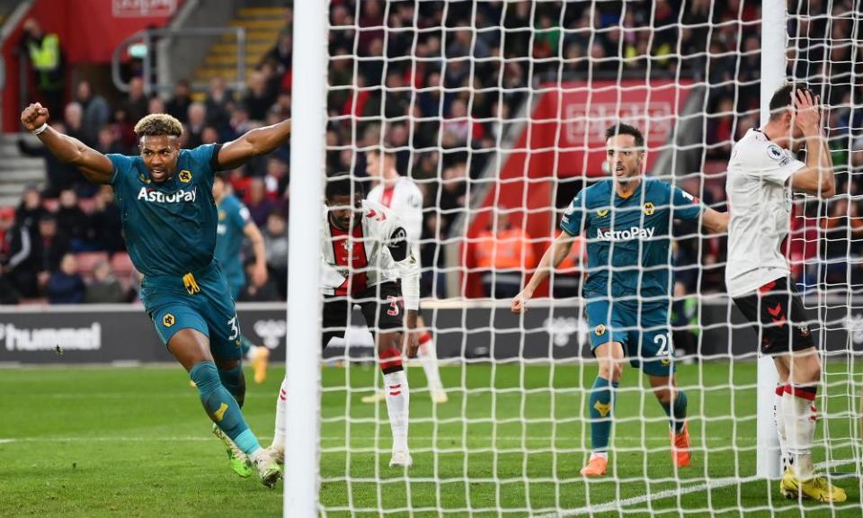 Adama Traoré leads the Wolves celebrations after Jan Bednarek’s own goal.