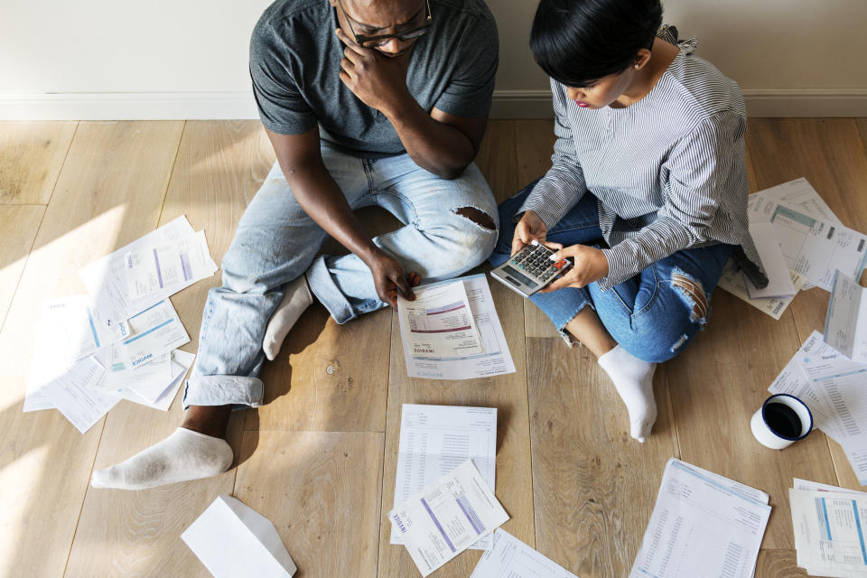 Couple managing debt. Source: Getty