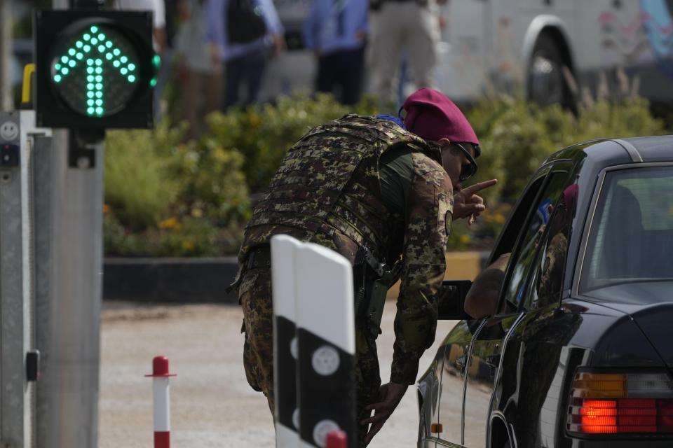 Italian Army soldier patrols at a roadblock near Borgo Egnatia, venue of the G7 summit in southern Italy, Wednesday, June 12, 2024. (AP Photo/Gregorio Borgia)