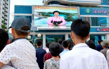 North Koreans watch a news report showing North Korea's nuclear test on electronic screen in Pyongyang, North Korea, in this photo taken by Kyodo September 3, 2017. Mandatory credit Kyodo/via REUTERS