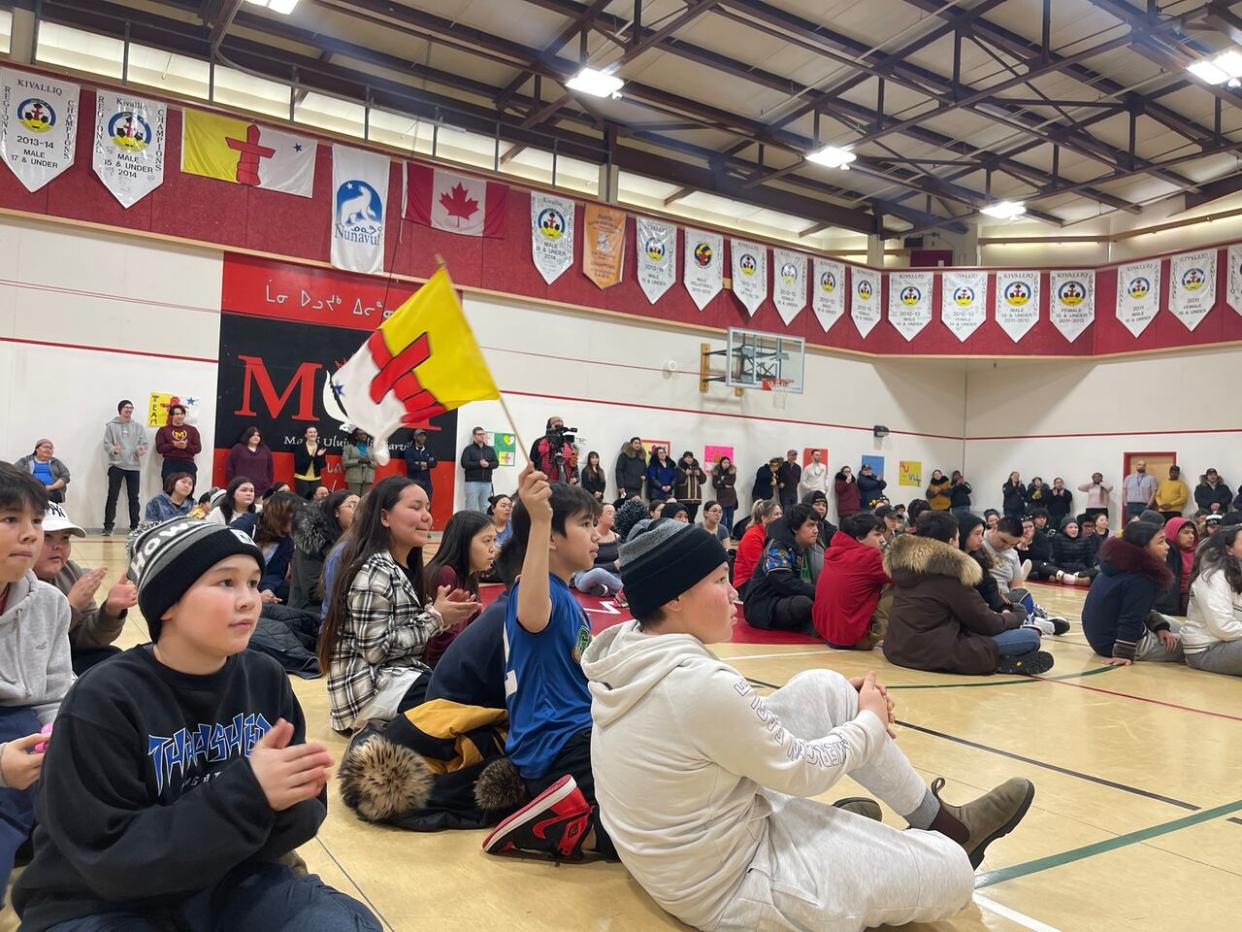 Students at Maani Ulujuk Illiniarvik in Rankin Inlet, Nunavut, take part in a pep rally on Thursday for their peers heading to the upcoming Arctic Winter Games.  (Juanita Taylor/CBC - image credit)