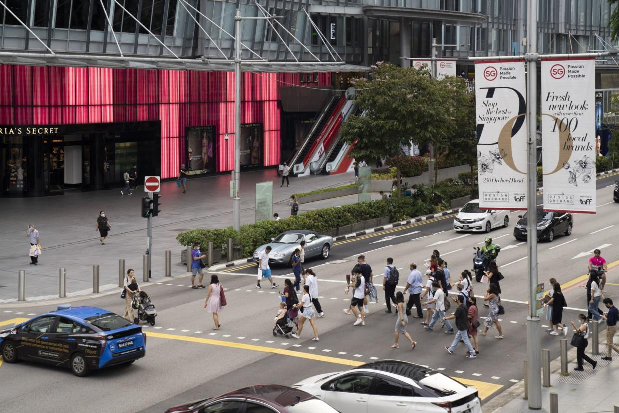 Pedestrians on Orchard Road in Singapore, on Monday, Aug. 22, 2022. Singapore announces its consumer price index (CPI) figures on Aug. 23. Photographer: Ore Huiying/Bloomberg