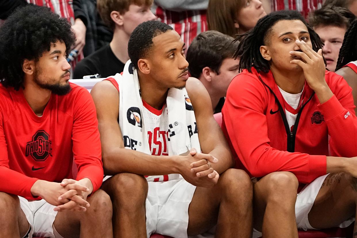 Jan 10, 2024; Columbus, Ohio, USA; Ohio State Buckeyes guard Taison Chatman (3), forward Zed Key (23) and forward Devin Royal (21) watch from the bench during the second half of the NCAA men’s basketball game against the Wisconsin Badgers at Value City Arena. Ohio State lost 71-60.