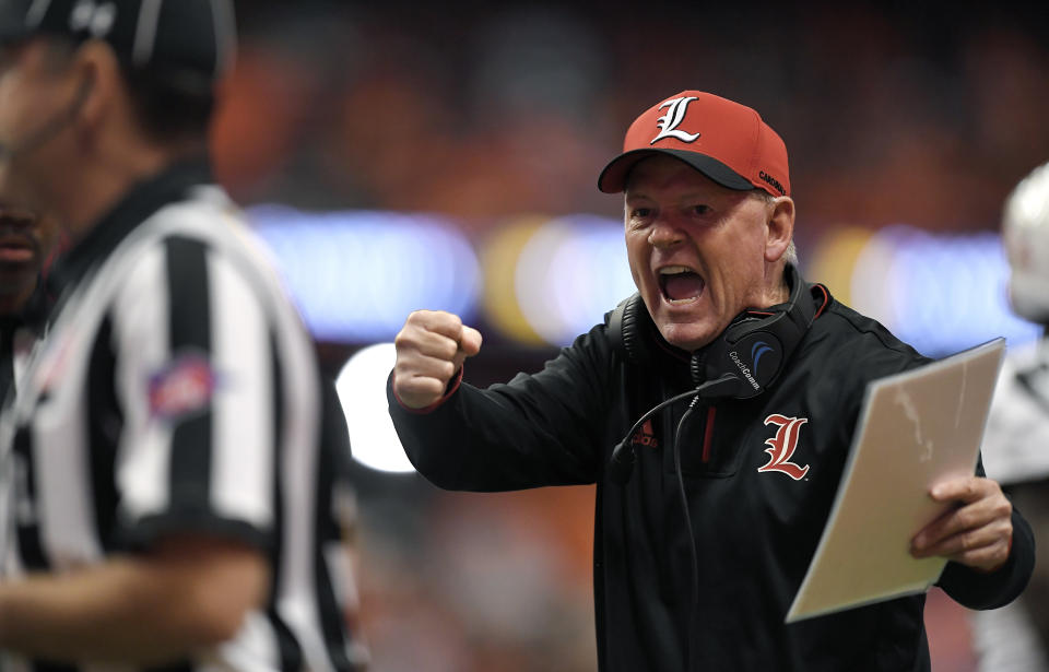 FILE - In this Nov. 9, 2018, file photo, Louisville head coach Bobby Petrino tries to get the referees attention during the first half of an NCAA college football game against Syracuse, in Syracuse, N.Y. Petrino, a coach with a track record of on-the-field success but off-the-field embarrassments, will be the next coach at Missouri State, the university said Wednesday, Jan. 15, 2020. (AP Photo/Adrian Kraus, File)