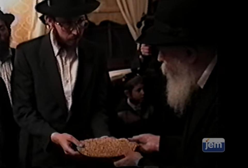 Rabbi Yisrael Greenberg from Chabad of El Paso receives a Matzah from the Rebbe on his birthday, four days before Passover 1988.