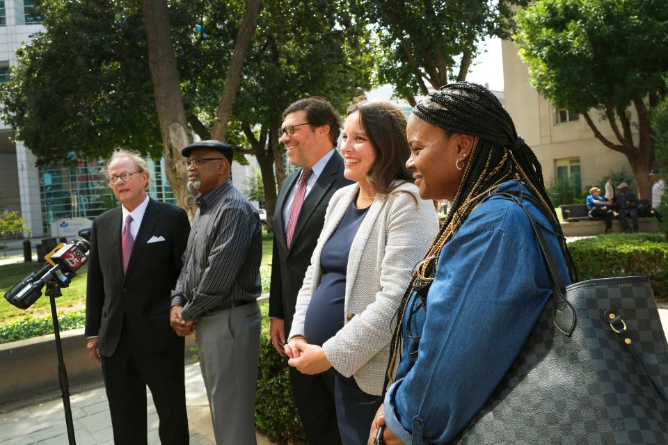 Glynn Simmons, a former death row inmate released after 48 years in prison, is joined by lawyers John Coyle, left, Joe Norwood and Amber Leal, and his cousin Cecilia Hawthorne, right. Simmons saw his murder case dismissed officially and held a news conference with his attorneys on Sept. 20 outside the Oklahoma County Courthouse.