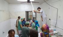 Afghan MSF surgeons work in an undamaged part of the MSF hospital in Kunduz on October 3, 2015, after the operating theatres were destroyed in an air strike