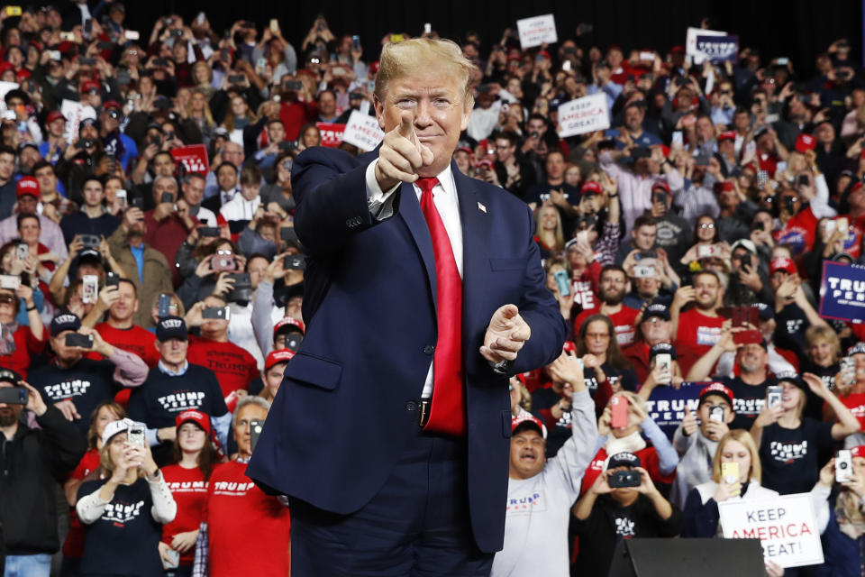 FILE - In this Jan. 9, 2020, file photo, President Donald Trump points as he arrives to speak at a campaign rally, in Toledo, Ohio. (AP Photo/ Jacquelyn Martin, File)