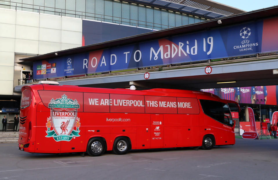 The Liverpool team bus arrives under the Road to Madrid sign ahead of the UEFA Champions League Semi Final.