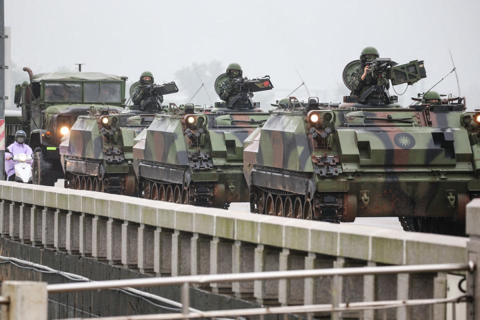 Taiwanese armoured vehicles roll down a street in Kinmen (AFP via Getty Images)