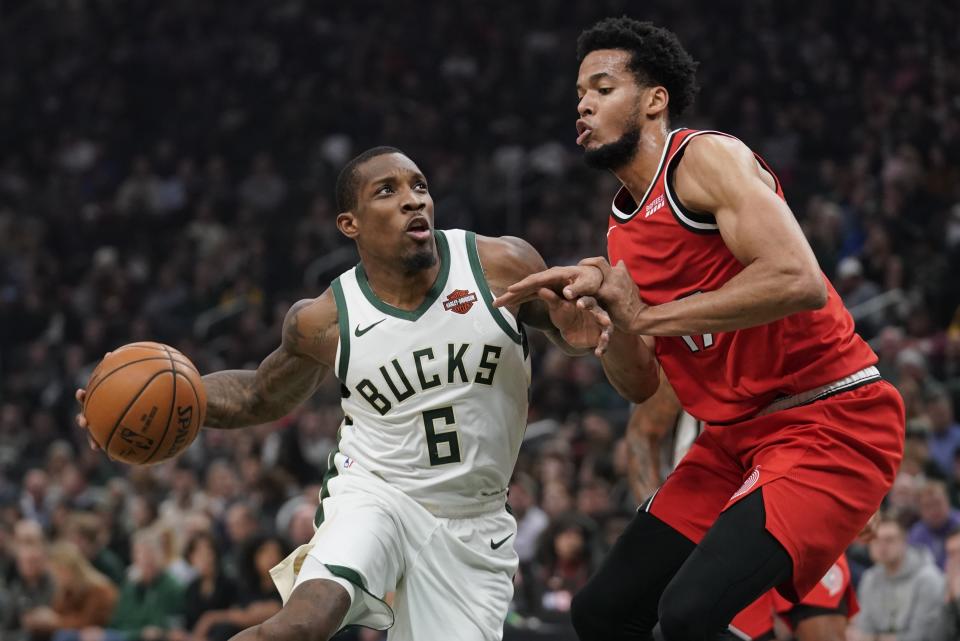 Milwaukee Bucks' Eric Bledsoe tries to drive past Portland Trail Blazers' Skal Labissiere during the first half of an NBA basketball game Thursday, Nov. 21, 2019, in Milwaukee. (AP Photo/Morry Gash)