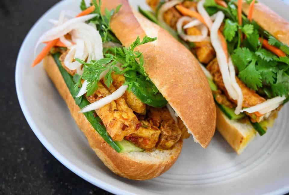 A chili lemongrass tofu sandwich at Sizzle n’ Steam is a Vietnamese bánh mì-style sandwich served on a toasted French baguette dressed with pate, mayonnaise, cucumber, cilantro and pickled carrot, daikon and jalapeño.