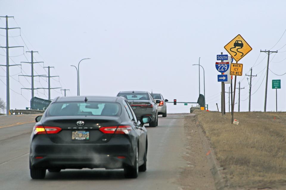 Cars on Benson Road take prepare to take the off ramp toward I-229 South during rush hour on Monday, March 27. Construction on a diverging diamond interchange, which is meant to help with traffic and reduce accidents, is set to begin April 3.