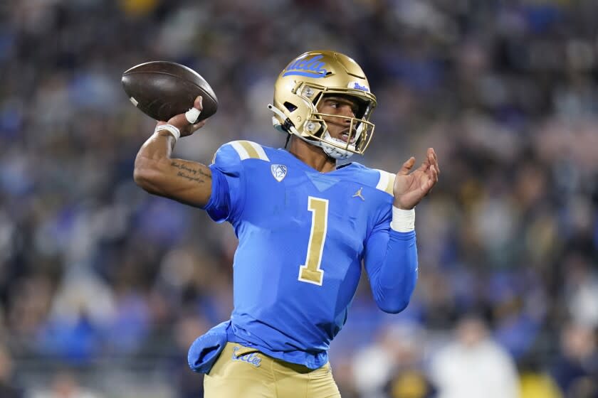 UCLA quarterback Dorian Thompson-Robinson throws a pass during the first half Nov. 27, 2021.