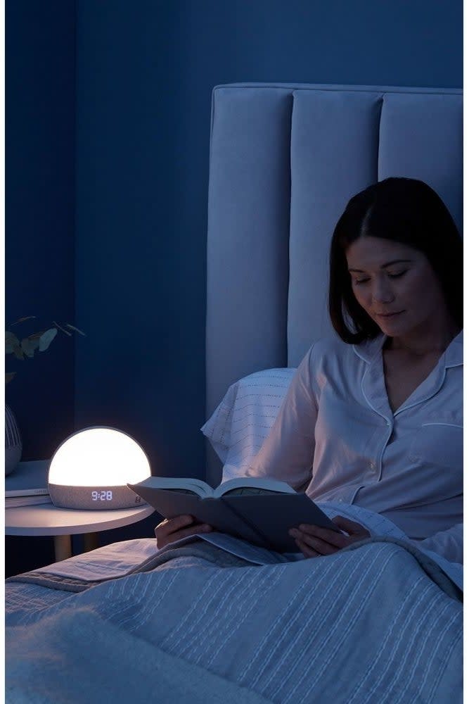 the hatch glowing at night while someone reads a book