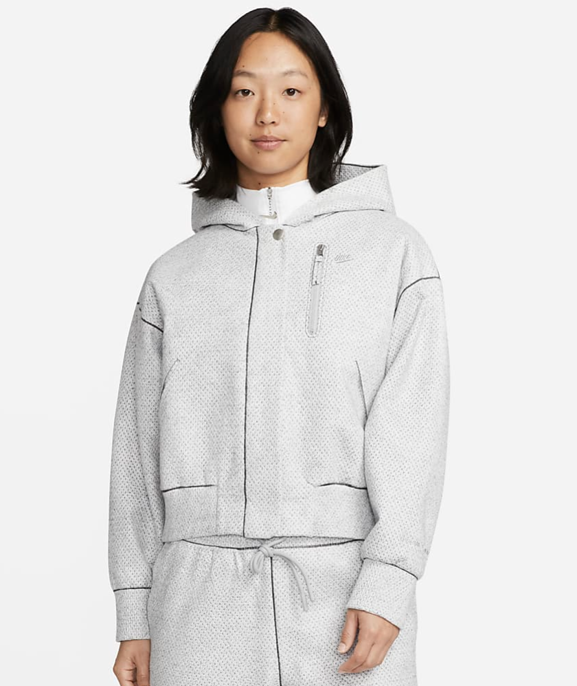 A model wears a Nike jacket.