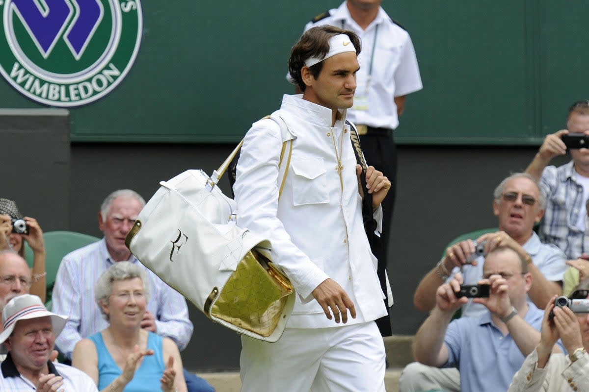 Roger Federer looking the part on Wimbledon’s Centre Court with his gold trimmed sport holdall in 2009  (AFP via Getty Images)