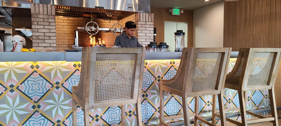 Unidos's ceviche bar fronts an open kitchen with a custom wood-burning grill.