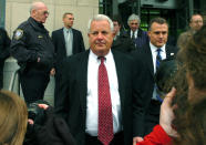 FILE - In this Feb. 12, 2009 file photo, Michael Conahan, center, leaves the federal courthouse in Scranton, Pa. The film "Kids for Cash" set to open explores the scandal that entangled thousands of children in Pennsylvania's juvenile court system and sent two former judges to prison. Mark Ciavarella is serving a 28-year sentence and fellow ex-judge Conahan is serving 17 years for taking $2.6 million from companies looking to build and fill a youth detention center for Luzerne County. (AP Photo/David Kidwell, File)