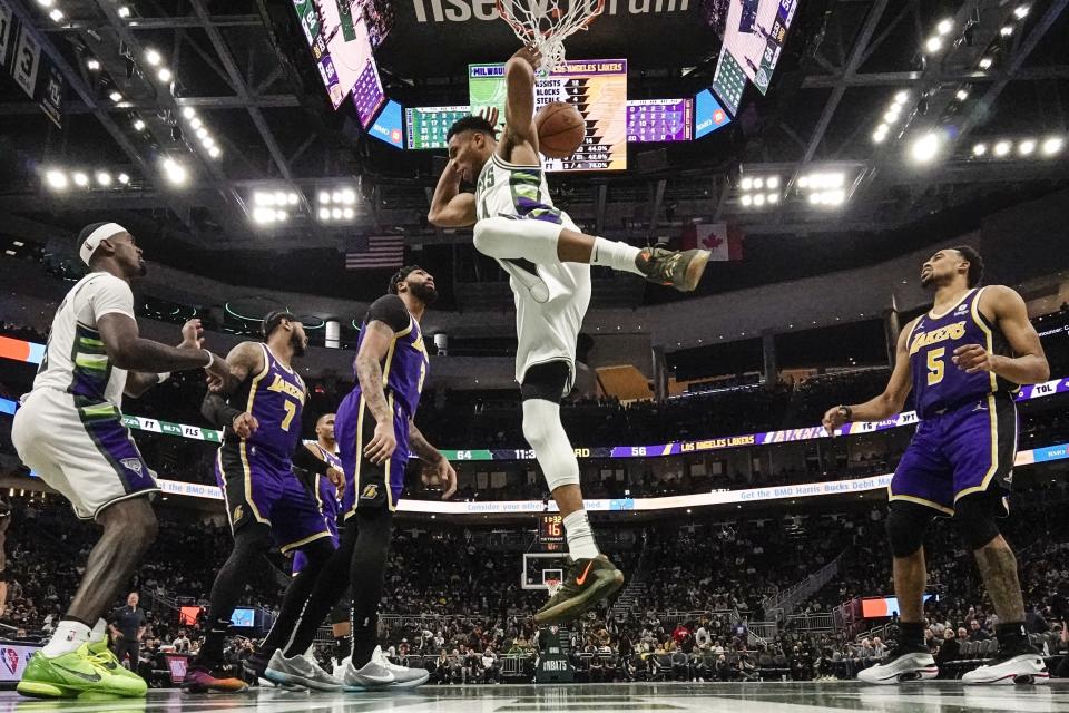 Milwaukee Bucks' Giannis Antetokounmpo dunks during the second half of an NBA basketball game against the Los Angeles Lakers Wednesday, Nov. 17, 2021, in Milwaukee. The Bucks won 109-102. (AP Photo/Morry Gash)
