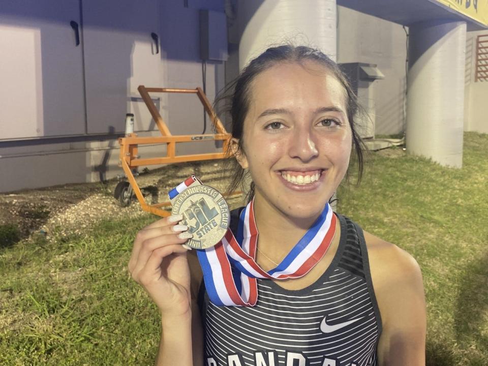 Randall senior Cameron McConnell poses with her 1,600 silver medal.