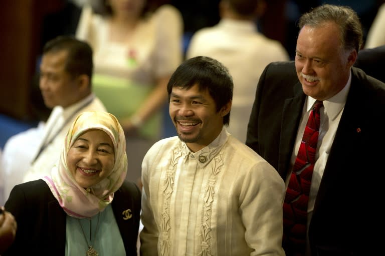 Philippine boxer and Congressman Manny Pacquiao poses for a picture before President Benigno Aquino delivers his State of the Nation address to lawmakers in Manila, on July 27, 2015