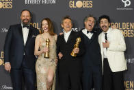 Yorgos Lanthimos, from left, Emma Stone, Willem Dafoe, Mark Ruffalo, and Ramy Youssef pose with the award for best motion picture, musical or comedy for "Poor Things" in the press room at the 81st Golden Globe Awards on Sunday, Jan. 7, 2024, at the Beverly Hilton in Beverly Hills, Calif. (AP Photo/Chris Pizzello)