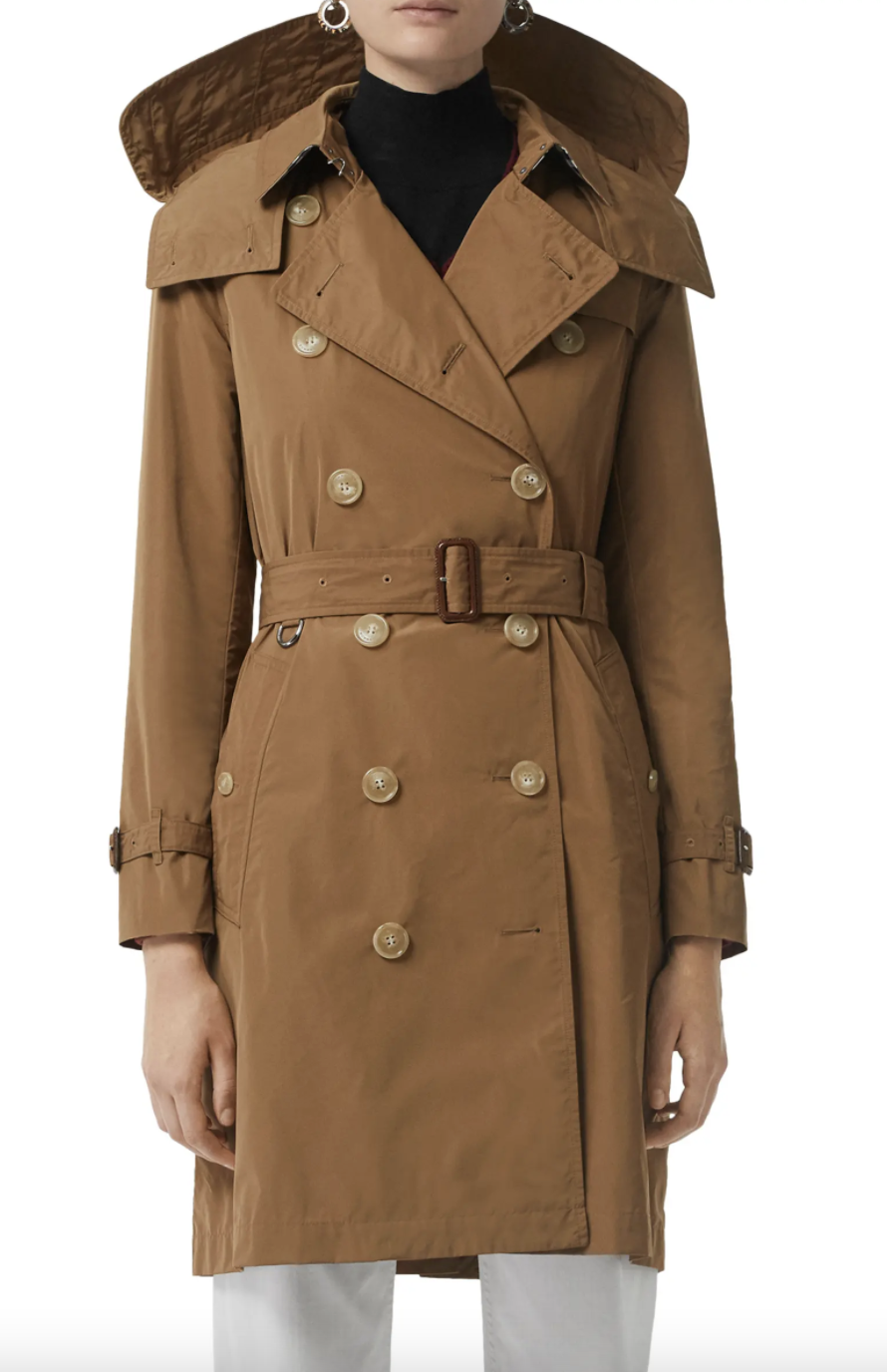 Burberry Kensington Trench Coat with Detachable Hood in brown with black sweater (Photo via Nordstrom)