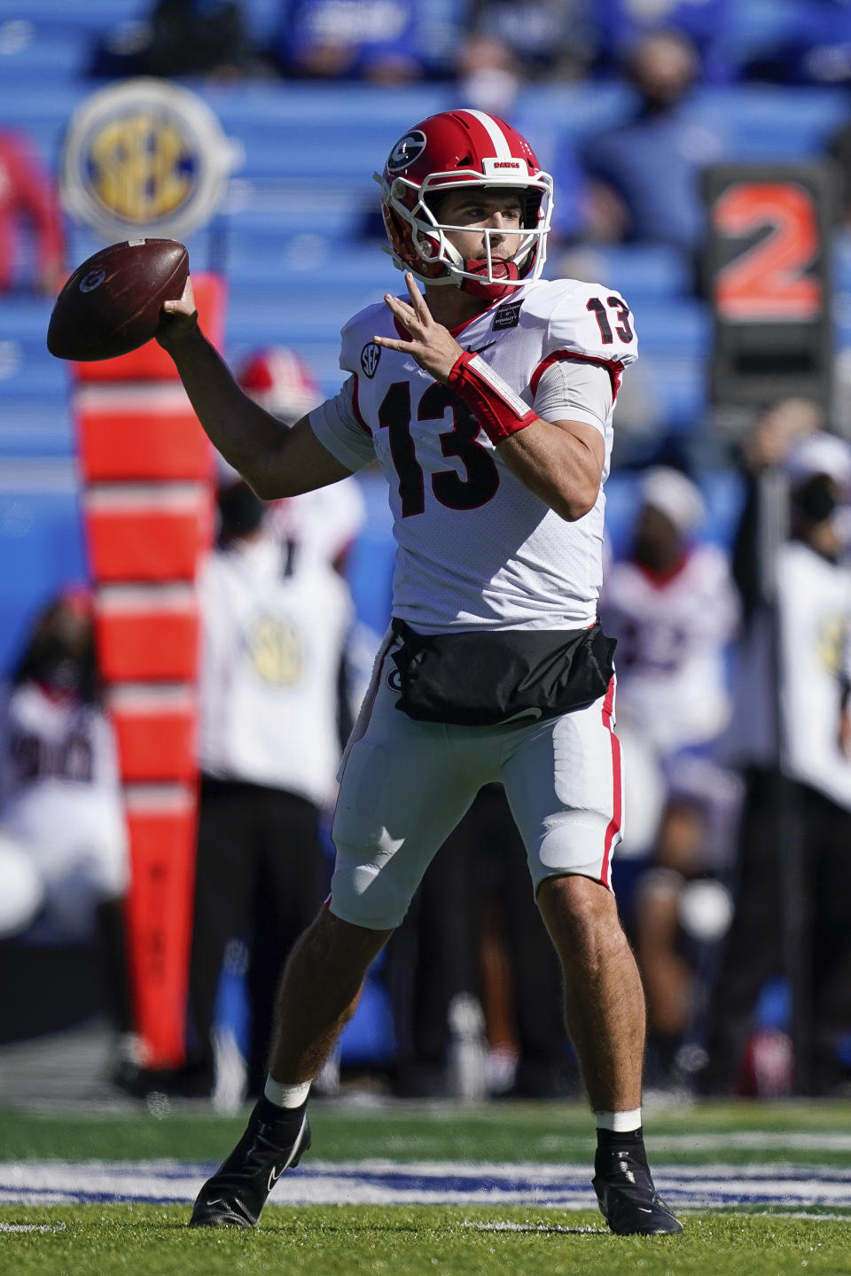 Georgia quarterback Stetson Bennett (13) passes during the first half of an NCAA college football game against Kentucky, Oct. 31, 2020, in Lexington, Ky. (AP Photo/Bryan Woolston)