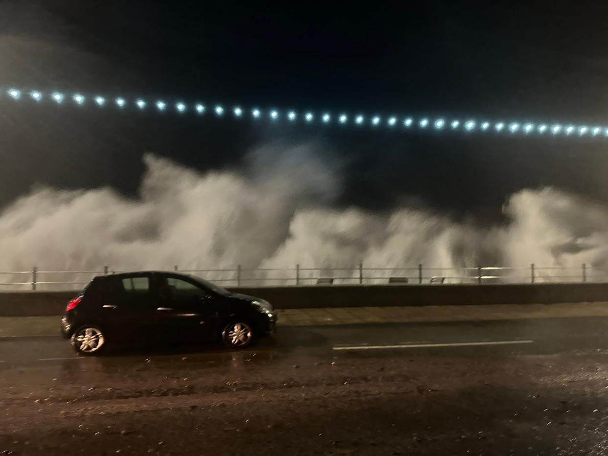 Waves crash over the sea wall in Penzance, Cornwall, as Storm Ciarán batters the country (PA)