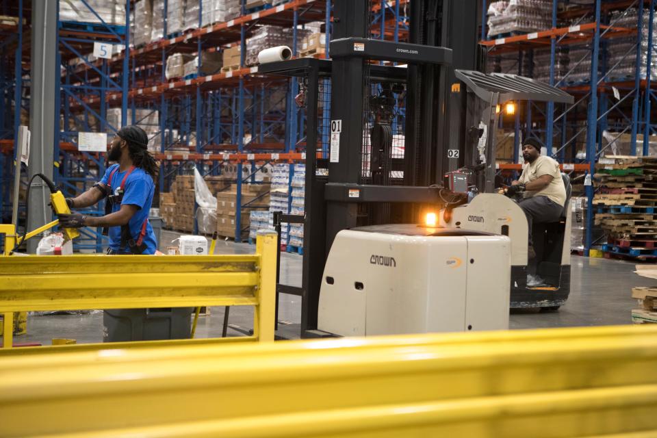 Workers at the DOT distribution warehouse work on shipments Thursday, August 26, 2021. Most distribution center jobs don't require a college degree.