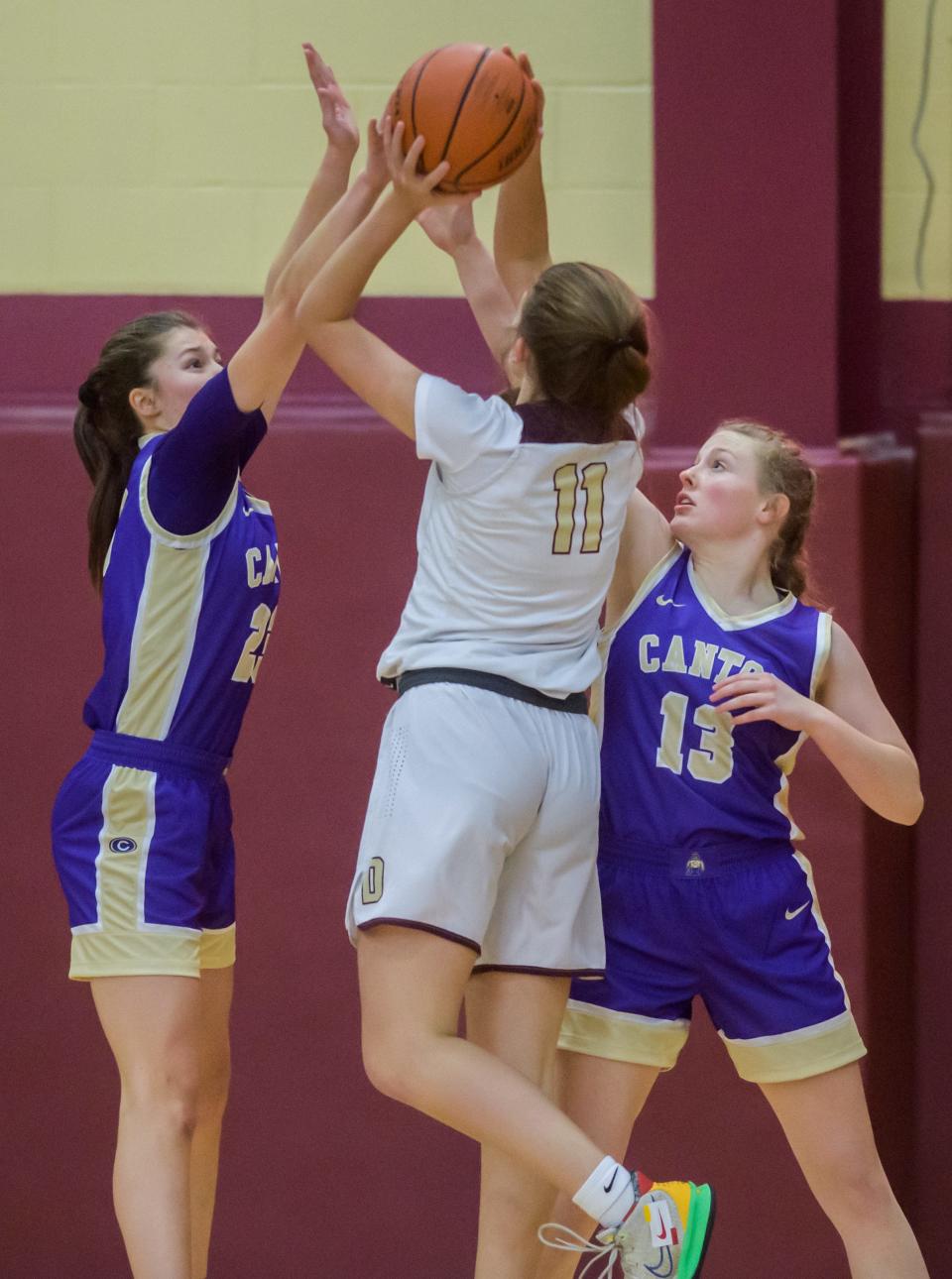 Canton's Allison Wheeler, left, and Karlee Zumstein, right, defend against Dunlap's Sutton Centoni in the second half Thursday, Dec. 15, 2022 at Dunlap High School. The Eagles defeated the Little Giants 68-53.