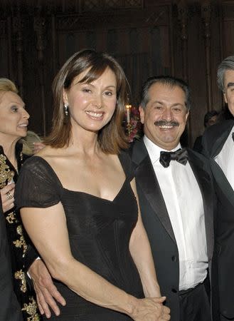 Dow CEO Andrew Liveris and his wife Paula are seen together in a Washington Life Magazine file photo from the Afghanistan Kuwait-America Foundation 2006 Benefit Dinner held in Washington March 8, 2006. MANDATORY CREDIT: Washington Life Magazine/Reuters