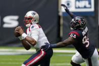 New England Patriots quarterback Cam Newton (1) is pressured by Houston Texans defensive end Charles Omenihu (94) during the second half of an NFL football game, Sunday, Nov. 22, 2020, in Houston. (AP Photo/David J. Phillip)